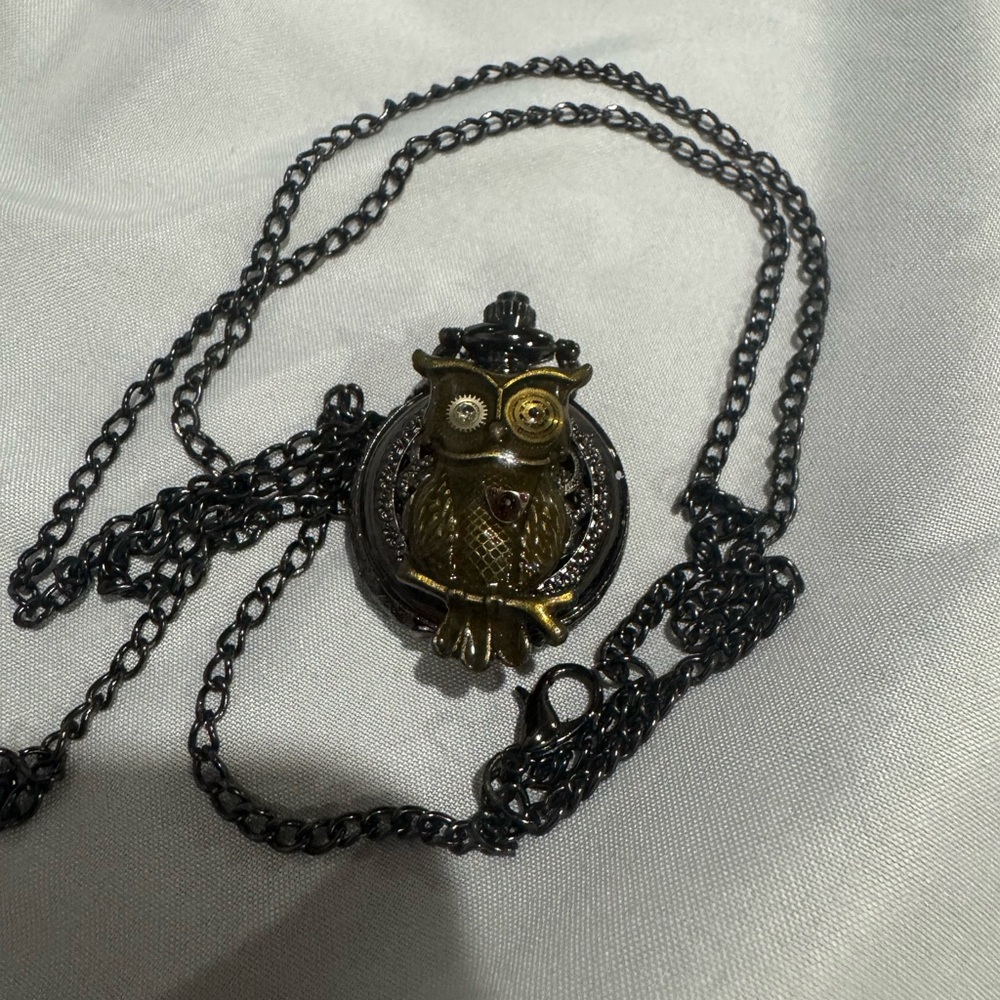 Trippy, steampunk, locket watch necklace.